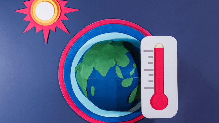 Illustration of Earth beside a red thermometer and sun symbol representing extreme global heat.