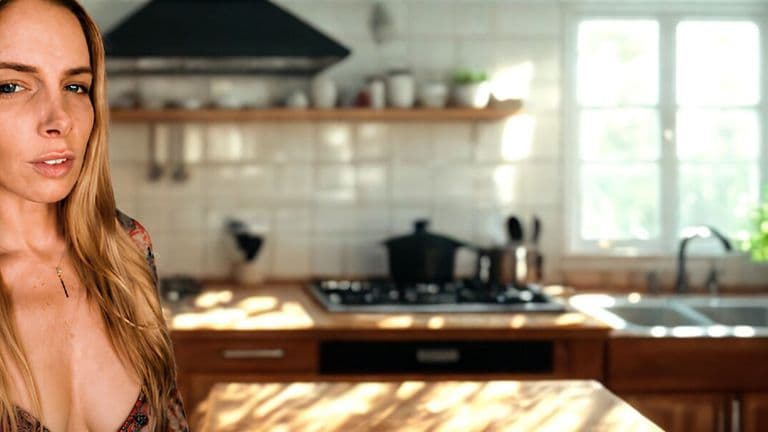 Author Ava Tyler standing in a sunlit kitchen, featured in wellness and culinary education article.