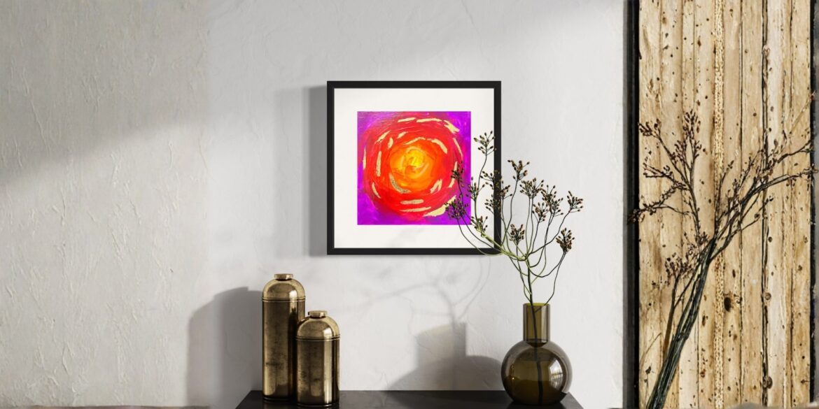 A vibrant, colorful abstract painting featuring swirling reds, oranges, and pinks, evoking energy and imagination in a minimalist setting.