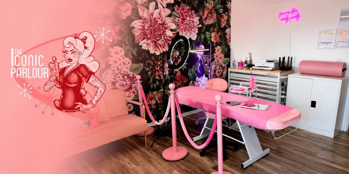 Interior of The Iconic Parlour featuring treatment bed, floral mural, and welcoming beauty studio environment.